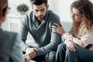 Couple on couch experiencing a push pull relationship.