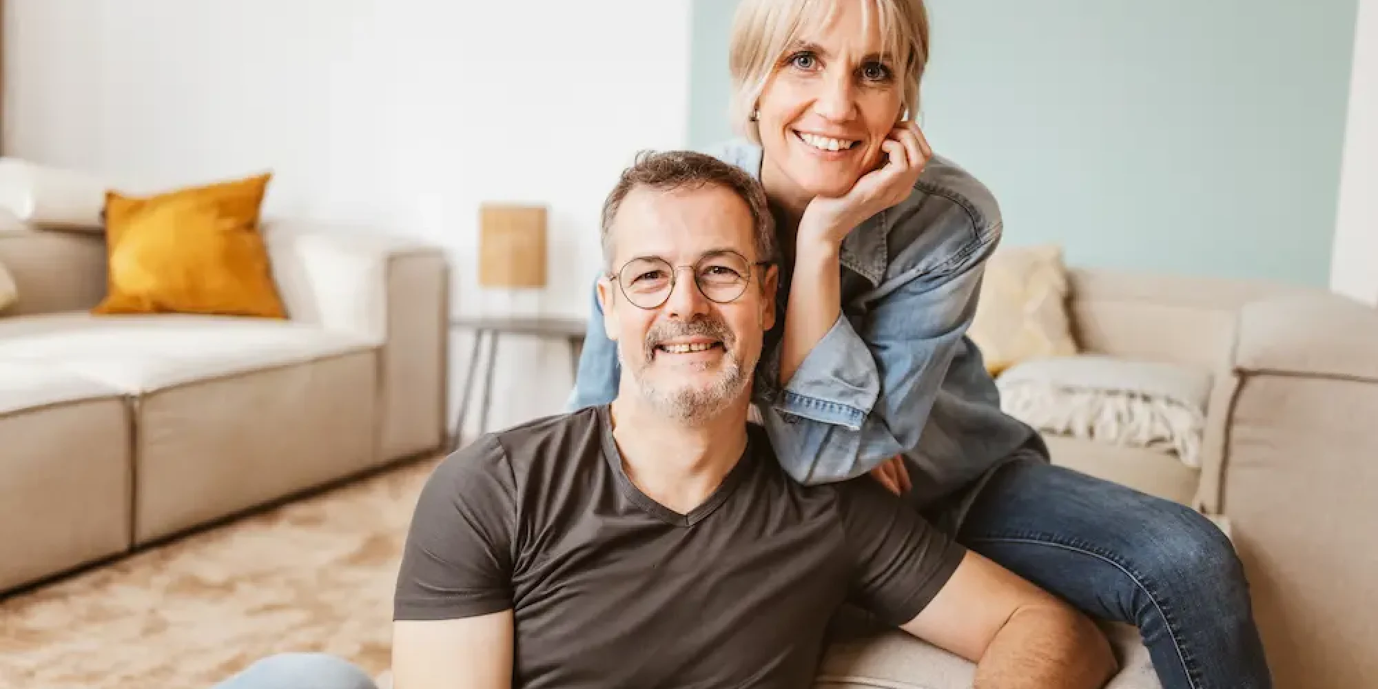 Too long without sex impact on relationship happy middle-aged couple sitting together at home.